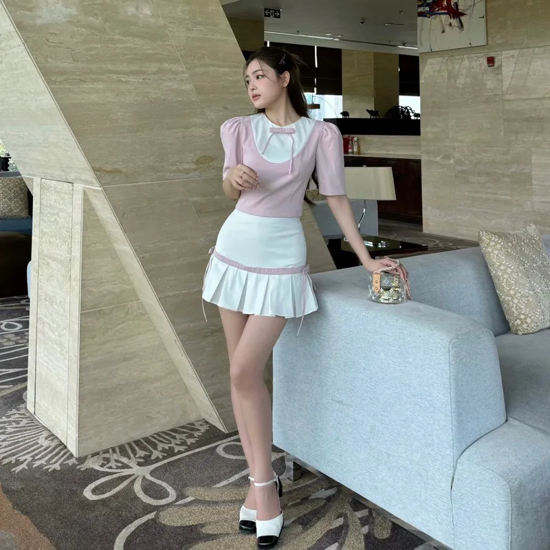 Ảnh Áo dáng ngắn tay phồng đính nơ màu hồng phối trắng PRINCESS phong cách nữ tính - Simple Twist 1