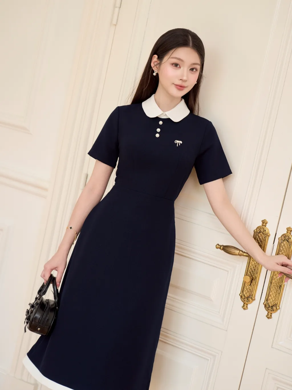 Ảnh Váy nữ dáng dài cổ sen ngắn tay phối viền trắng đính cúc ngọc và nơ đá trang trí YAME YV620 3